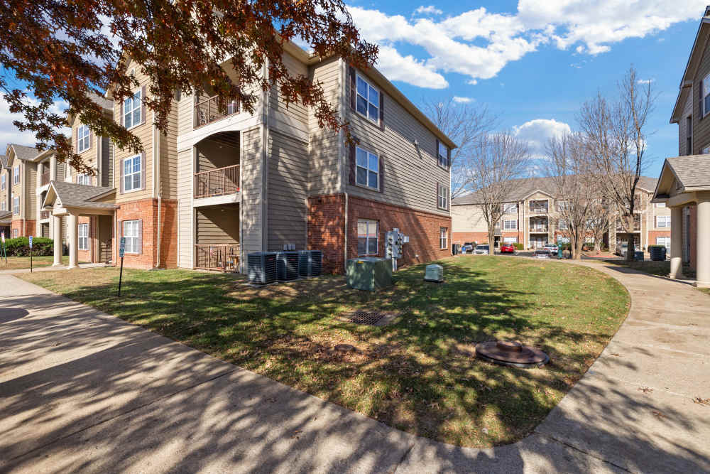 Community building with sidewalk at The Terraces At Copper Leaf in Nixa, Missouri
