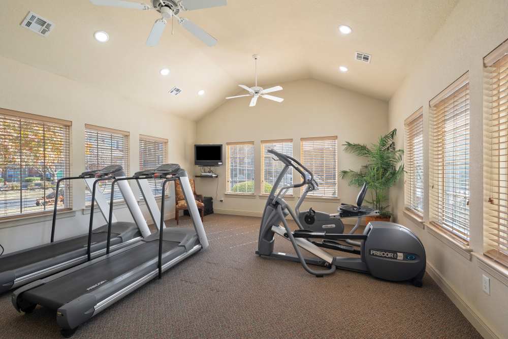 Fitness center with treadmills at The Terraces At Copper Leaf in Nixa, Missouri