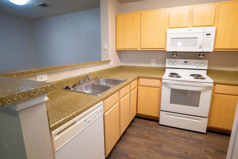 Kitchen with wooden flooring at Timber Village in Marshall, Texas