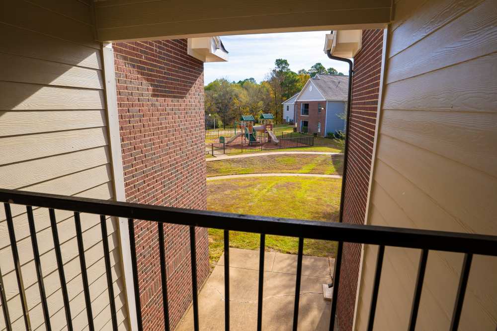 Patio with railing at Timber Village in Marshall, Texas