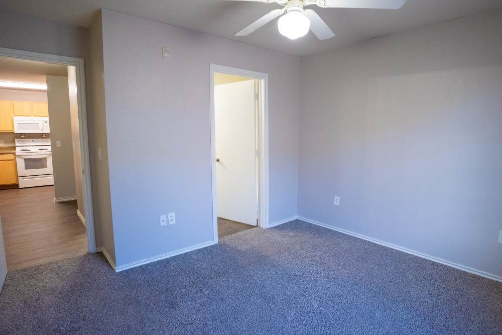 Bedroom with carpet flooring at Timber Village in Marshall, Texas