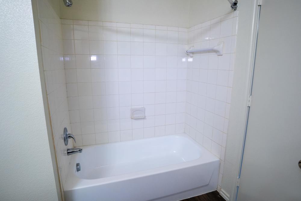 Bathroom with bathtub at Timber Village in Marshall, Texas 