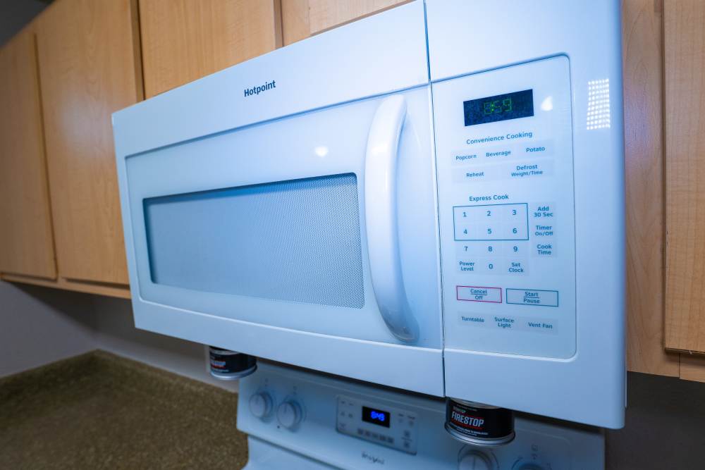 Kitchen with microwave at Timber Village in Marshall, Texas