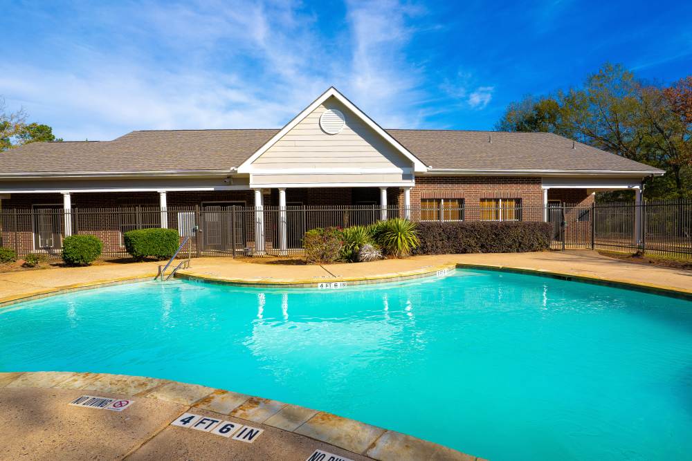Pool with leasing office at Timber Village in Marshall, Texas