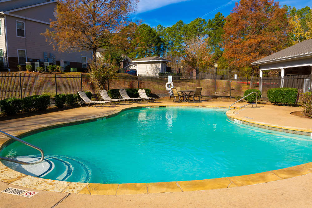 Pool with view to greenery at Timber Village in Marshall, Texas 