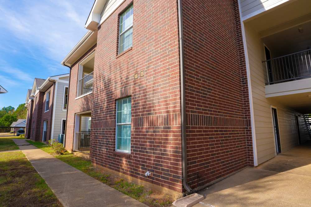 Building with sidewalk at Timber Village in Marshall, Texas