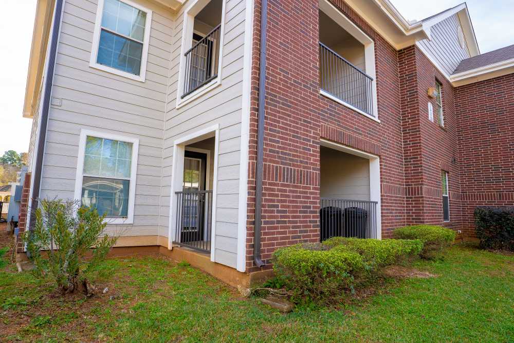 Building with grass lawn at Timber Village in Marshall, Texas