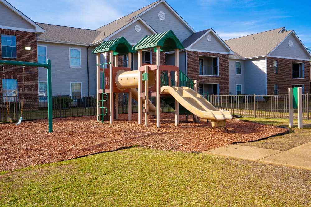 Playground with sliders at Timber Village in Marshall, Texas