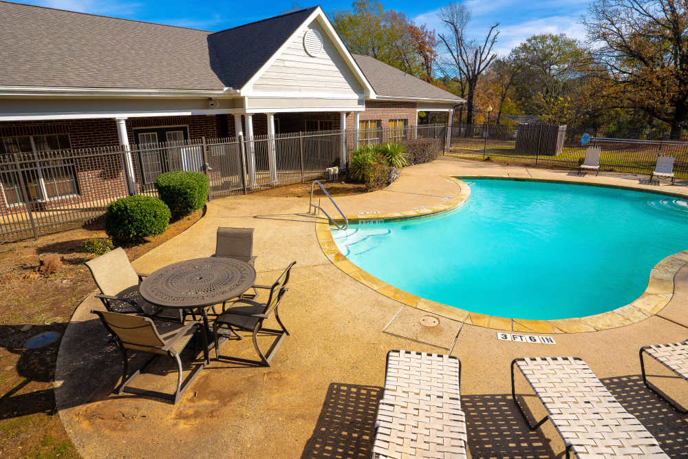 Pool with four seater chair and table at Timber Village in Marshall, Texas