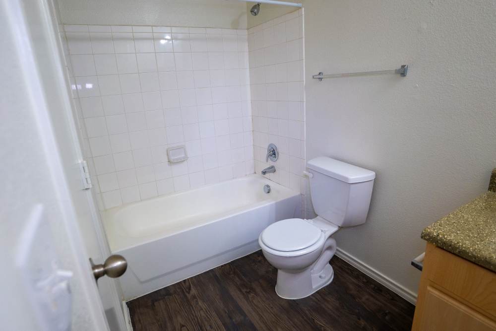 Bathroom with commode at Timber Village in Marshall, Texas