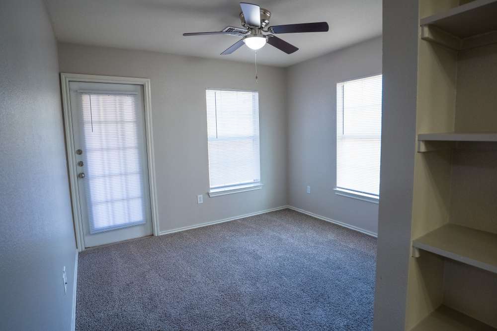Bedroom with two window at Timber Village in Marshall, Texas