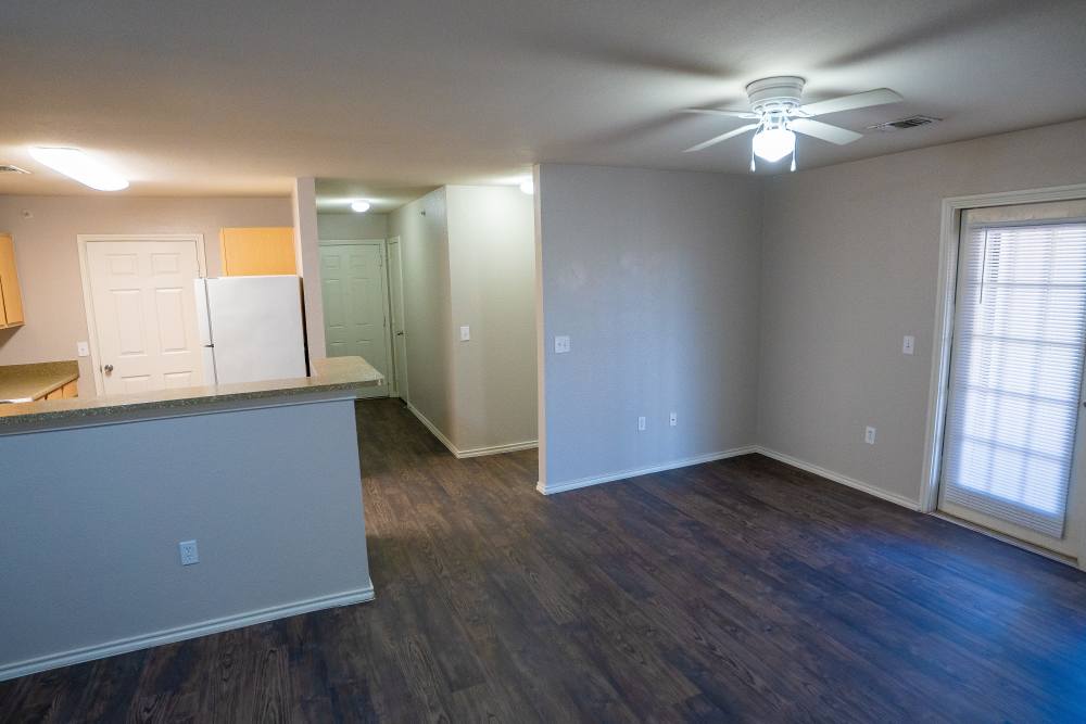 Living room with view to kitchen at Timber Village in Marshall, Texas