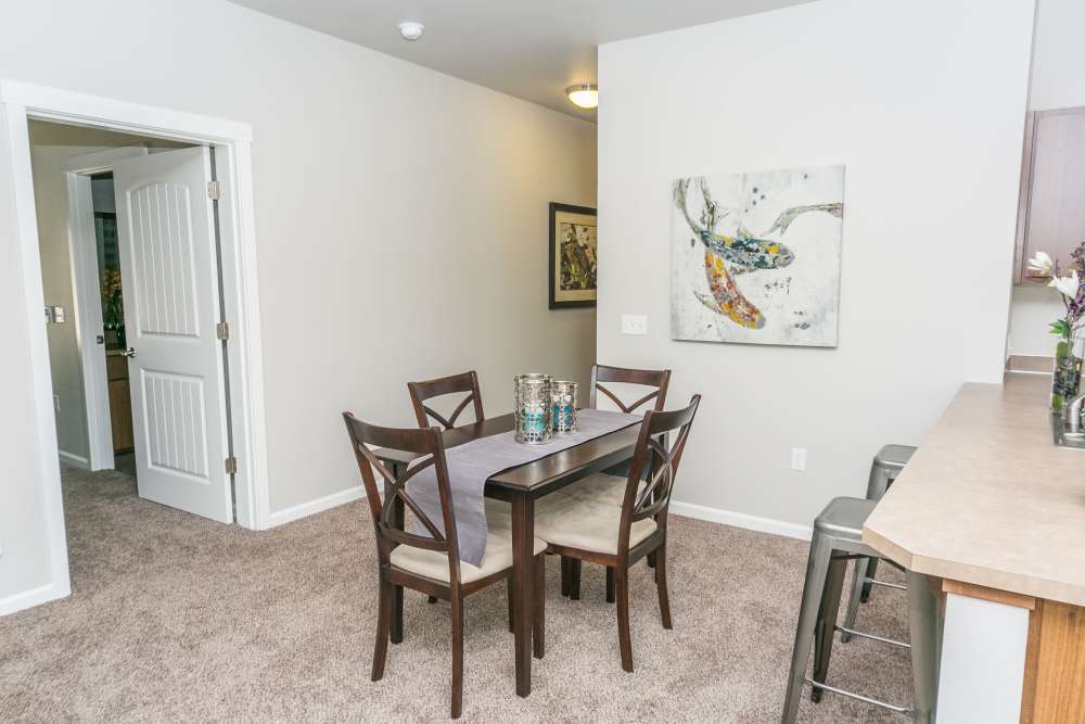 Dining area with four‑seat table beside kitchen counter at Columbia View in Vancouver, Washington