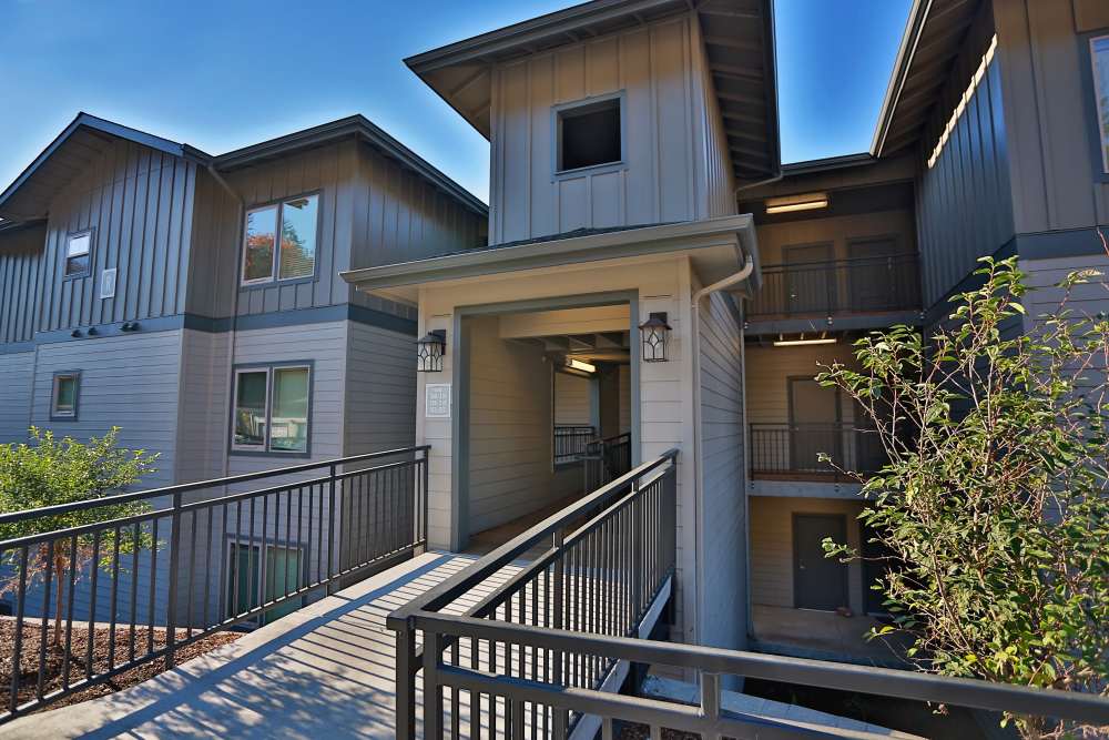 Apartment entrance with covered walkway and railings at Columbia View in Vancouver, Washington