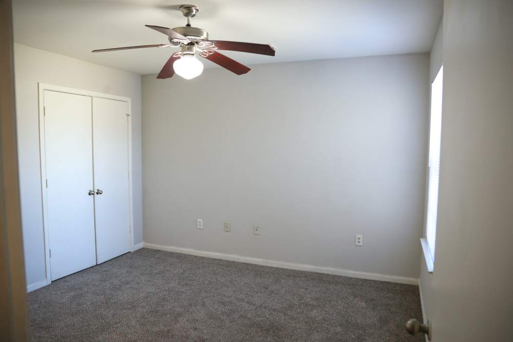 Bedroom with carpet flooring at Parkway Place in Greenwood,Mississippi