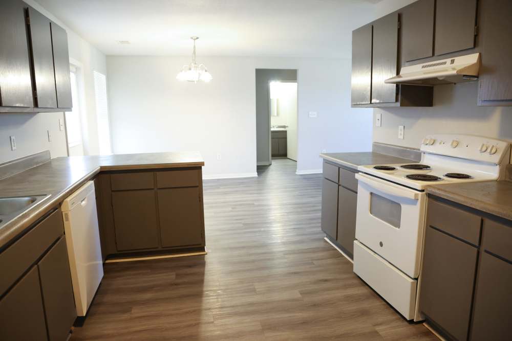 Kitchen with wooden cabinetry at Parkway Place in Greenwood,Mississippi