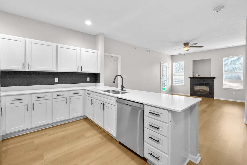 white cabinetry and white counters in kitchen at Pointe 28 in Ankeny, Iowa.