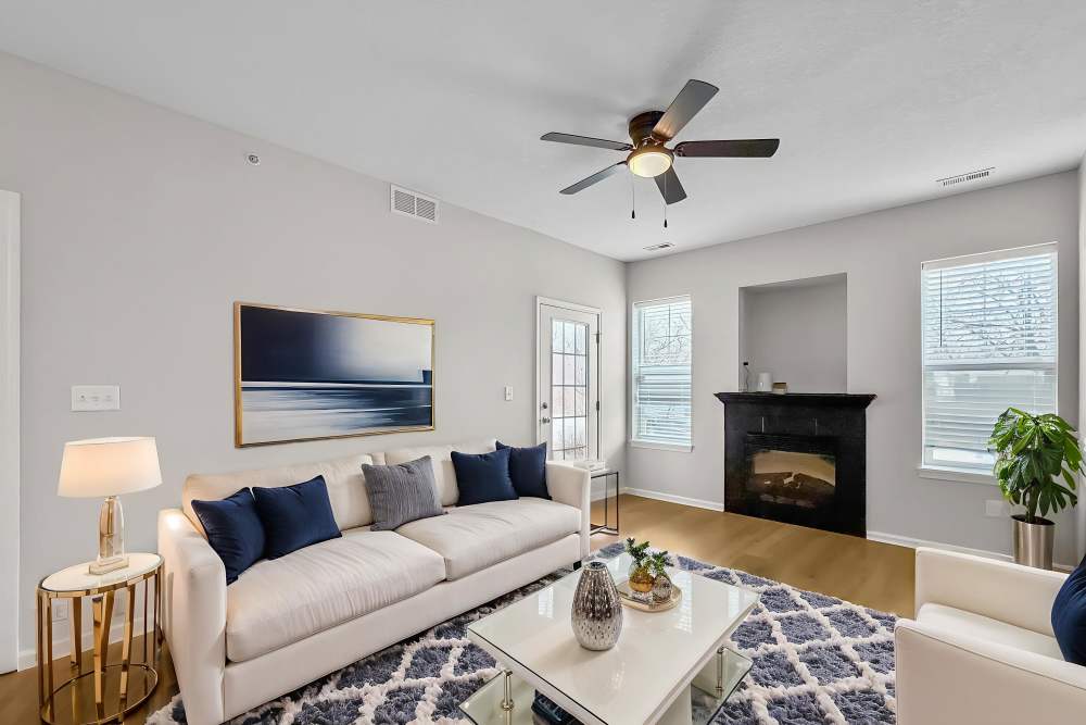 white couches and modern accessories in model unit at Pointe 28 in Ankeny, Iowa.