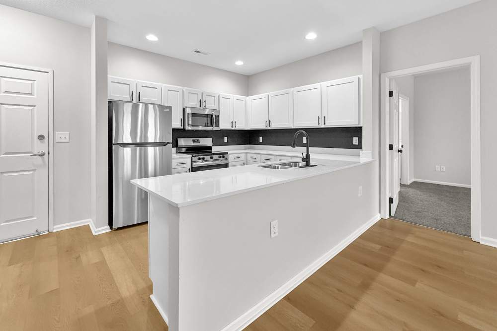 open concept kitchen, dining and living area at Pointe 28 in Ankeny, Iowa.