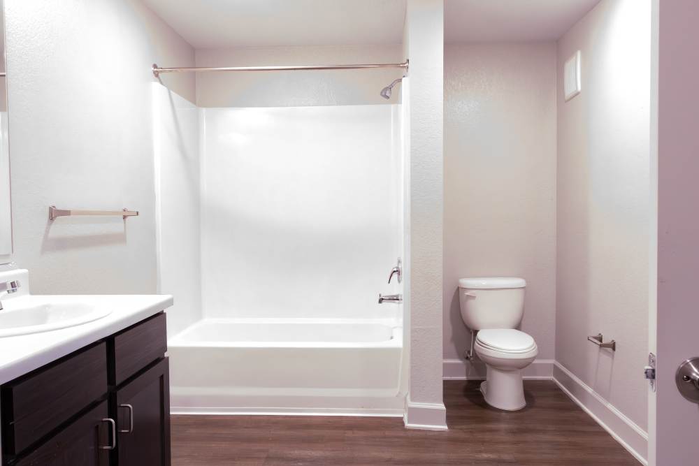 Modern bathroom with sink ,commode and bathtub at Villas At Mount Zion in Stockbridge, Georgia