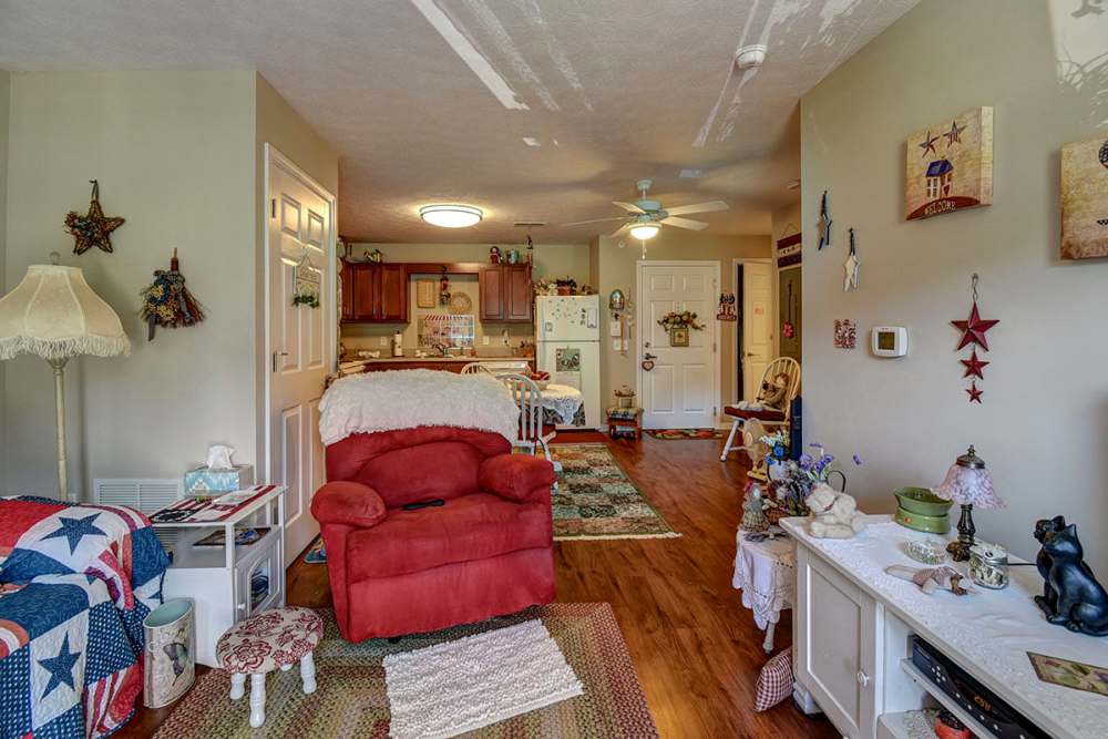 Living room with connecting kitchen at Capital Greene in Wheeling, West Virginia