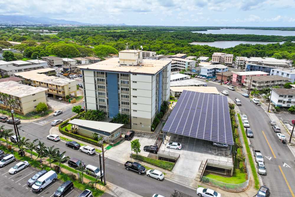 Beautiful aerial view of the apartment with parking cars at Waipahu Tower Apartments in Waipahu, Hawaii
