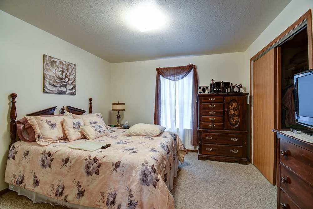 Spacious apartment bedroom with closets and storage cabinets at Muirwood Greene in Romney, West Virginia