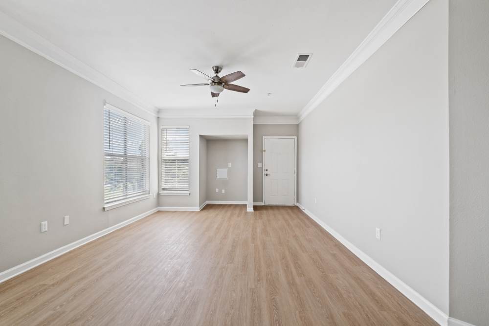 Bedroom with ceiling fan and in-built desk space at Highlands at Alexander Pointe in Charlotte, North Carolina
