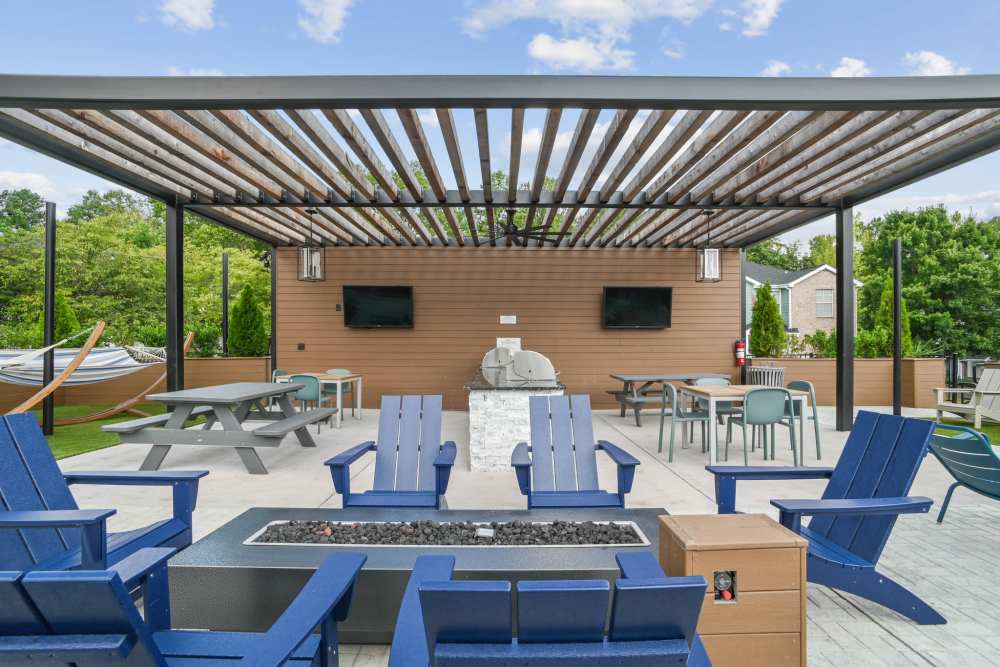 Outdoor fireplace with chairs at Highlands at Alexander Pointe in Charlotte, North Carolina