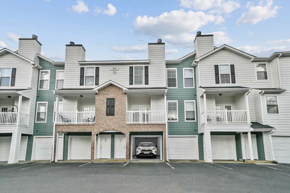 Exterior view of building with garage at Highlands at Alexander Pointe in Charlotte, North Carolina