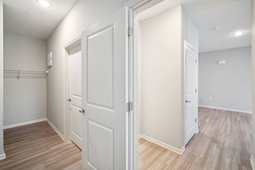Bedroom with connecting closet at The Alcove at Russell Cave in Lexington, Kentucky