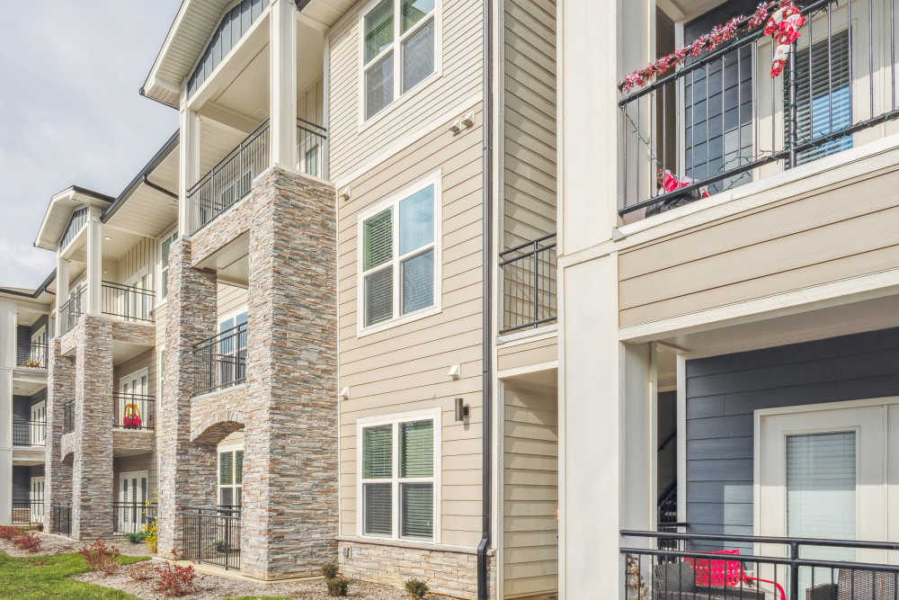 Apartment community with stone accents, balconies at Lone Oak Meadows in Louisville, Kentucky