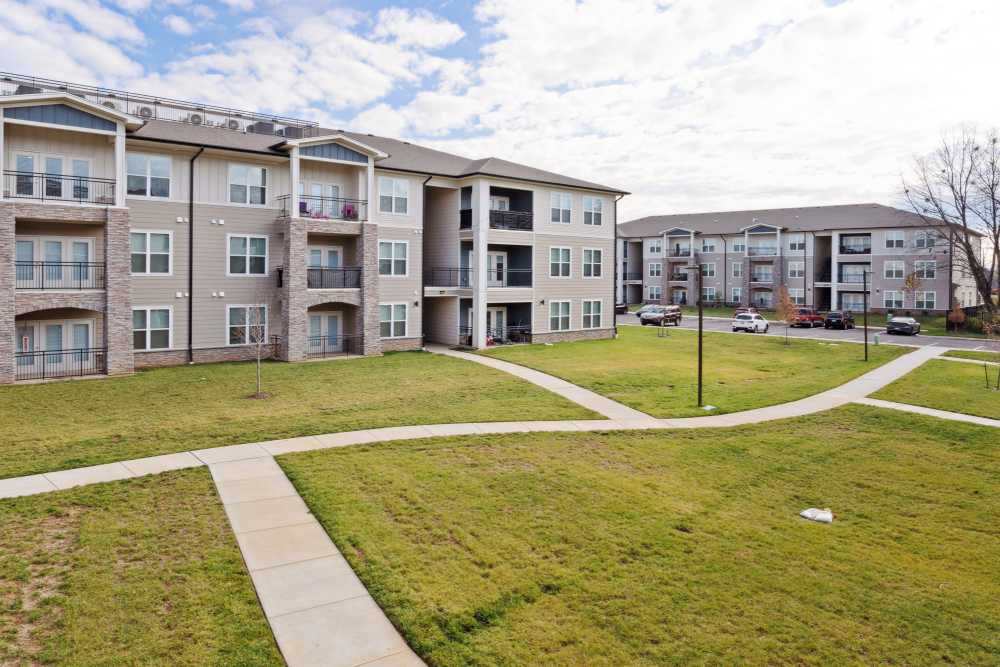 Modern apartment community with landscaped grounds at Lone Oak Meadows in Louisville, Kentucky
