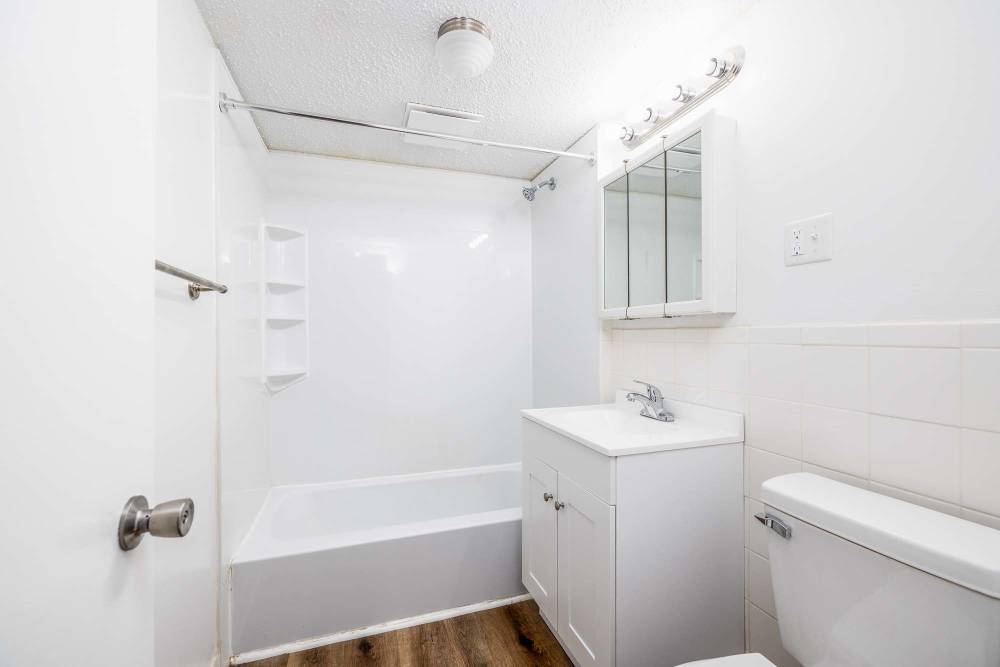 Bathroom Featuring a Shower Bathtub at Webster Park in Webster, New York