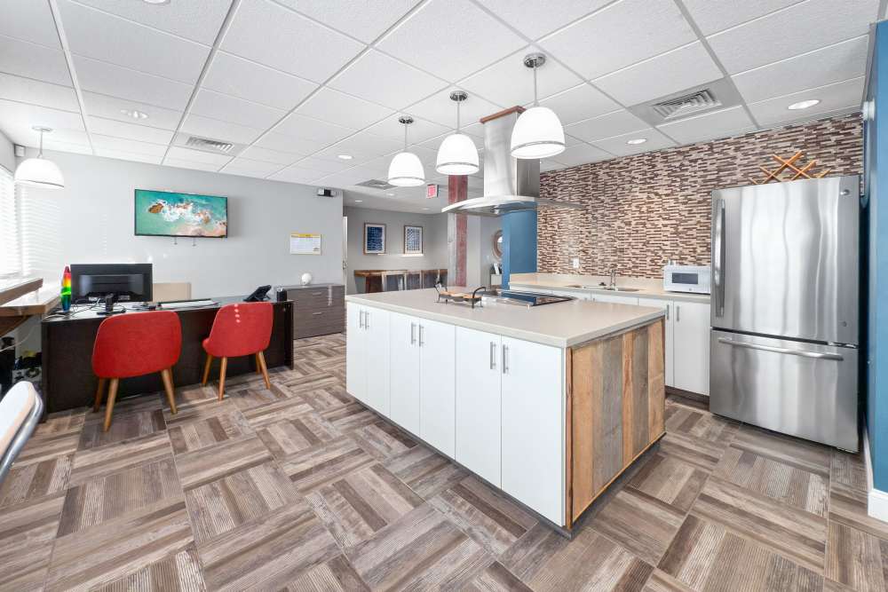 Leasing office reception and kitchen of community room at Union Flats & Townhomes in Lawrence, Kansas