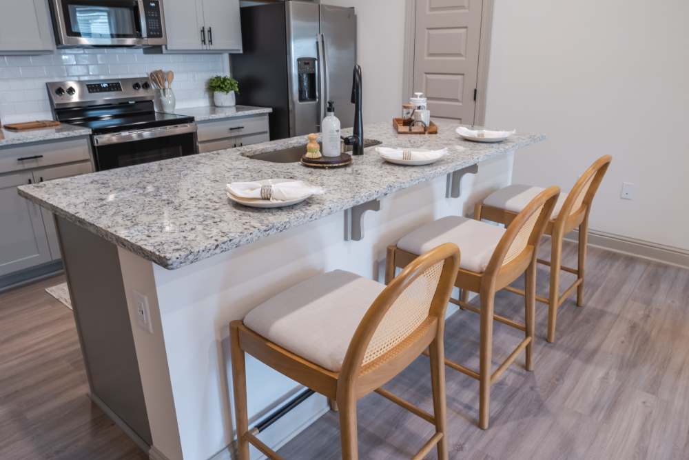 Kitchen island with plenty of seating at The Heights at Waterpointe in Flowood, Mississippi
