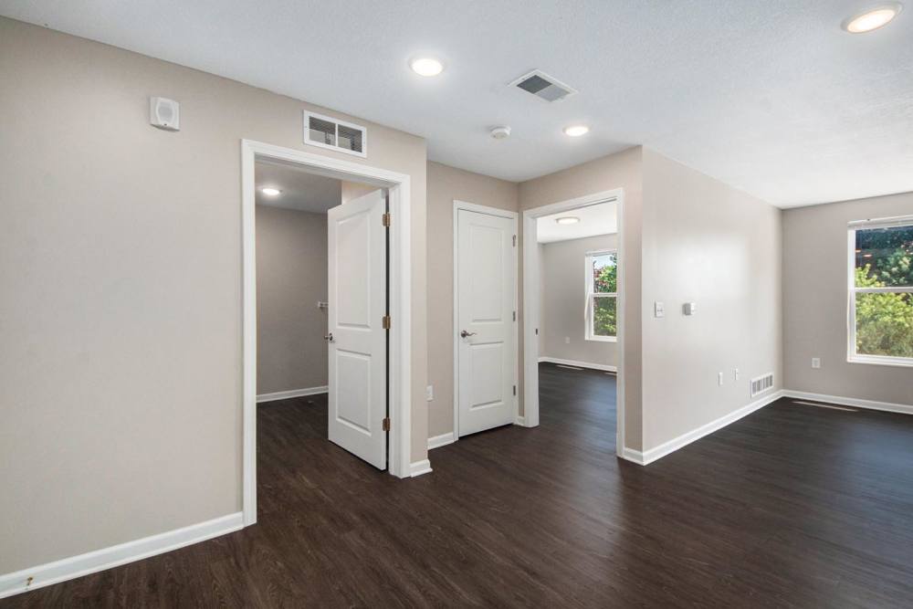 Open layout with wood-style flooring and natural light from large windows at Seven45 Stocking in Grand Rapids, Michigan