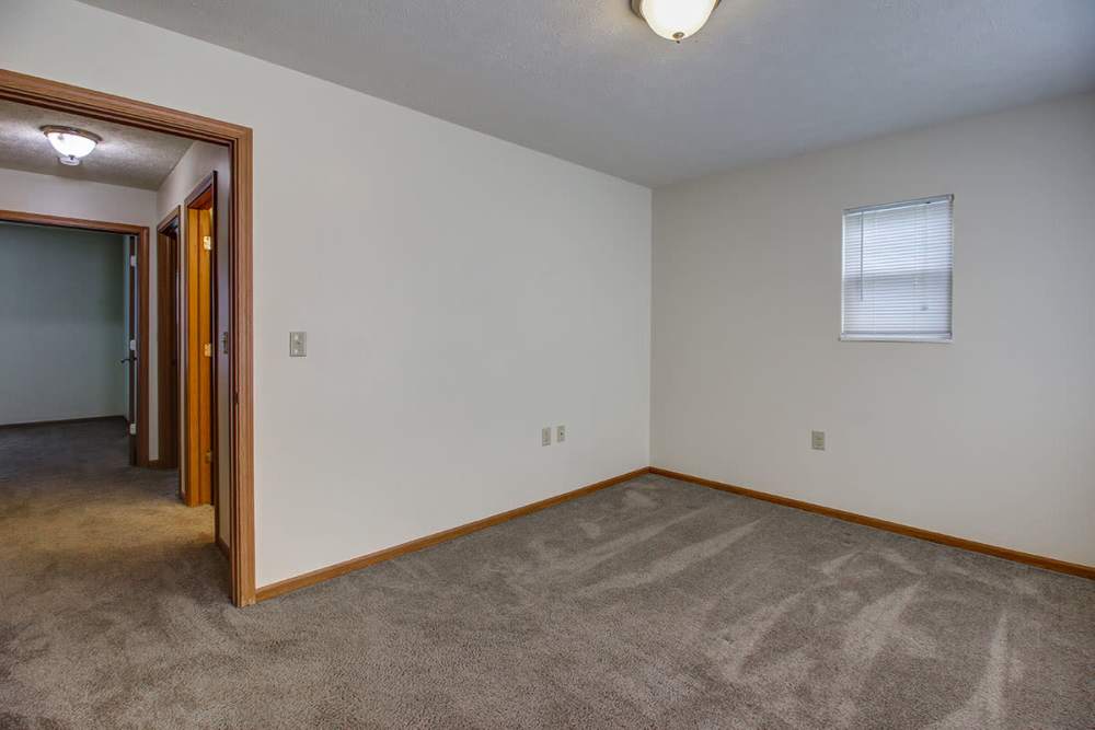 Spacious room with carpeted flooring and natural light from window at Sterling Greene in Fayetteville, Tennessee