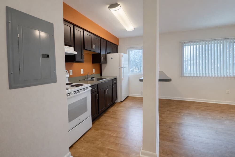 Open kitchen with wood flooring and windows at Weinberg Commons in , District of Columbia