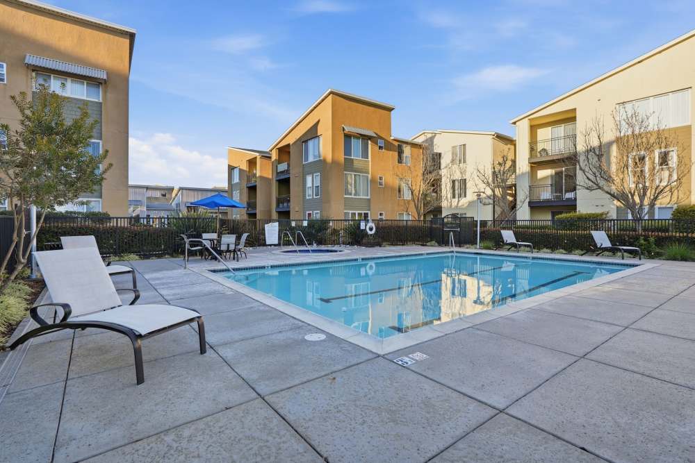 Resort-style pool with lounge chairs at Pacific Shores in Santa Cruz, California
