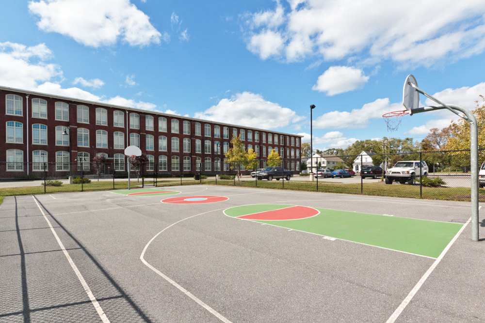 Community basketball court at Robertson on the River in Taunton, Massachusetts