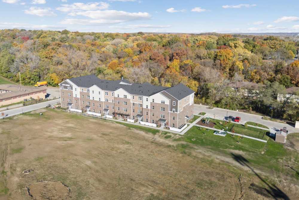 New apartment building surrounded by colorful autumn trees near Alley Landing in Des Moines, Iowa