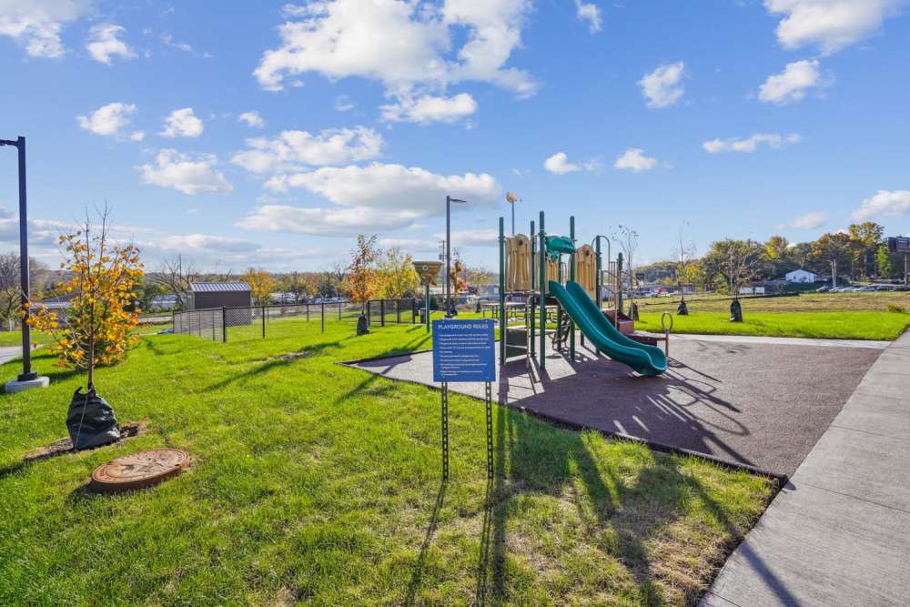 Playground with slides and grassy area near Alley Landing in Des Moines, Iowa