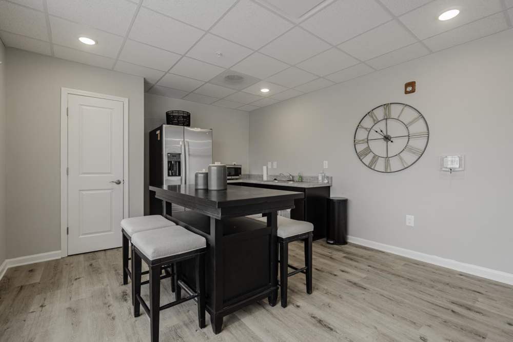 Modern community kitchen with granite countertop at Benton Crossing I in Columbia, South Carolina