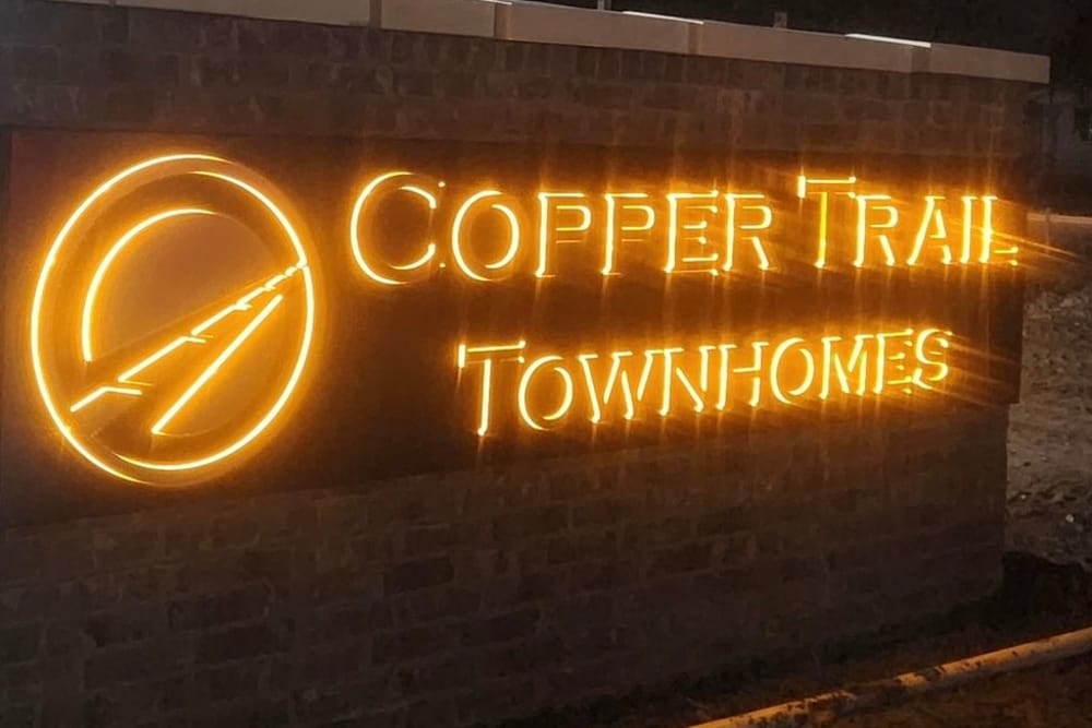 Copper Trail Townhomes illuminated sign at Copper Trail Townhomes in Owasso, Oklahoma