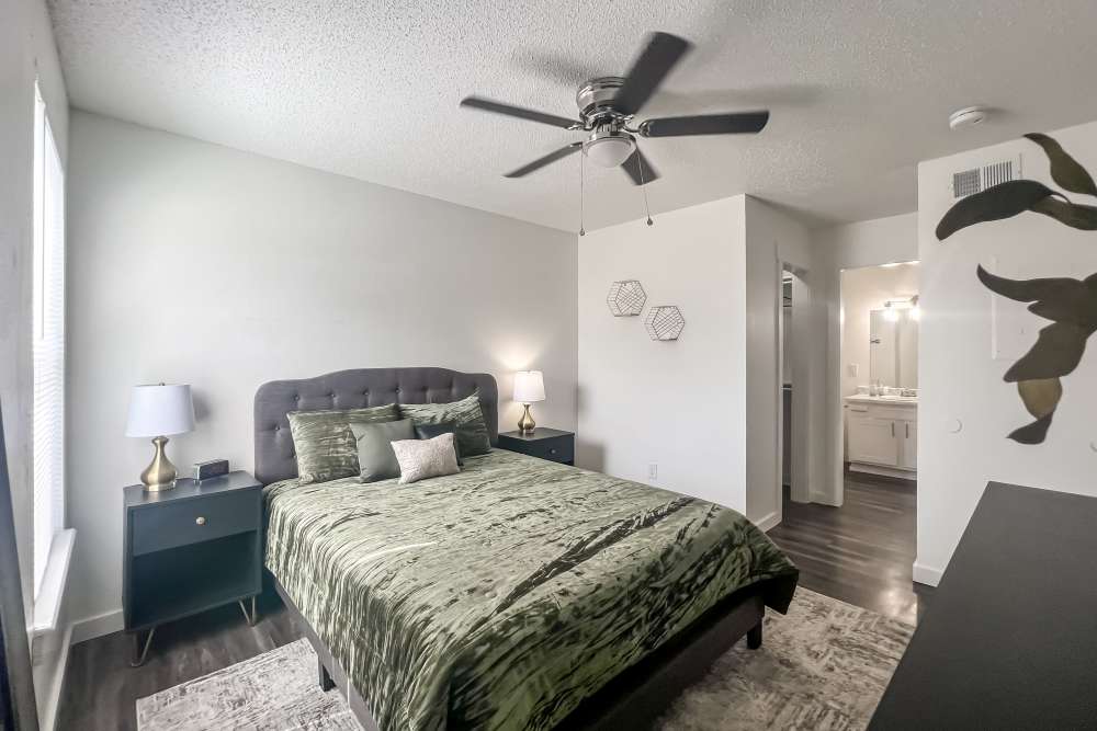 Bedroom with ceiling fan at Savannah Square & Savannah Harbor in Norman, Oklahoma