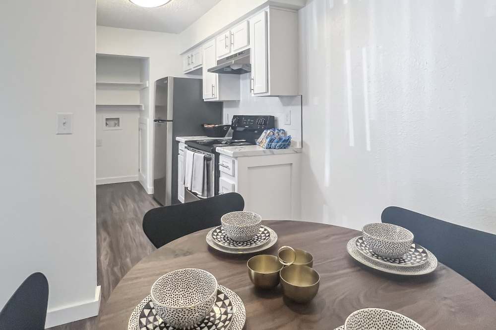 Dining area with view to kitchen at Savannah Square & Savannah Harbor in Norman, Oklahoma