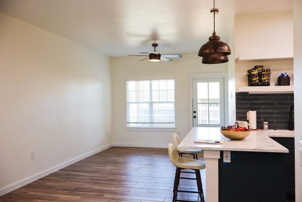 Open layout kitchen with granite countertops at Copper Trail Townhomes in Owasso, Oklahoma