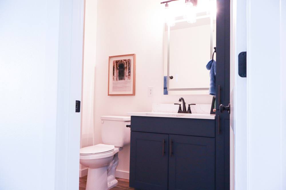 Modern bathroom with stylish fixtures and decor at Copper Trail Townhomes in Owasso, Oklahoma