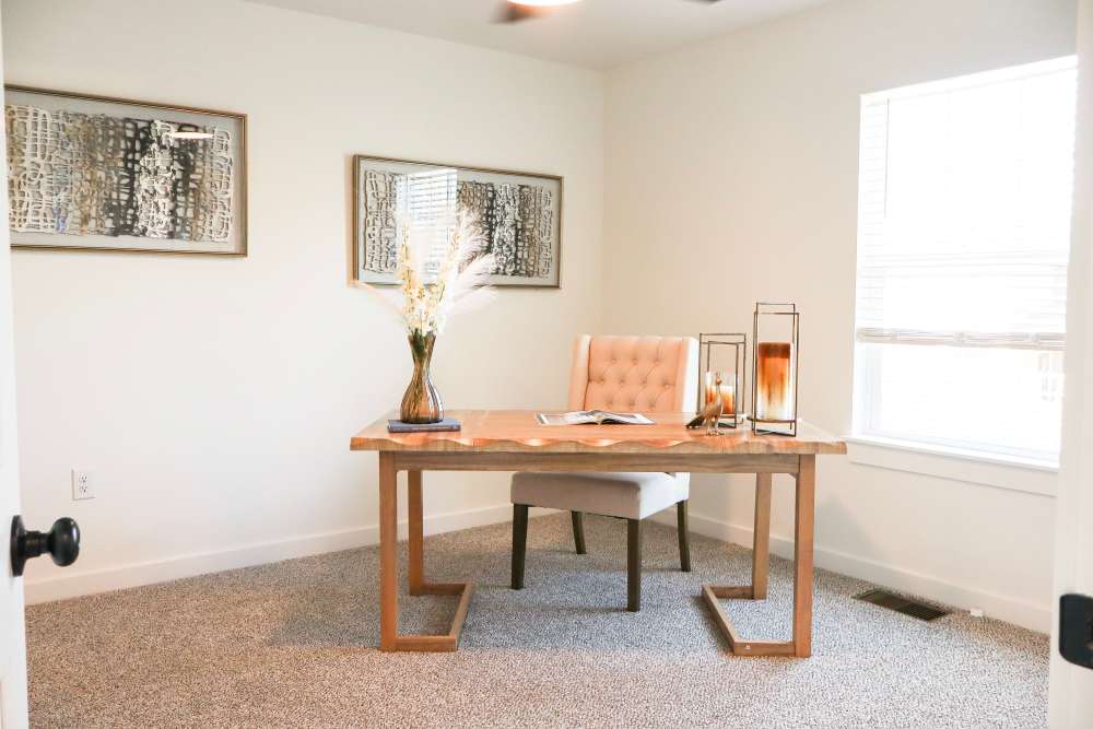 Cozy home office with natural light at Copper Trail Townhomes in Owasso, Oklahoma